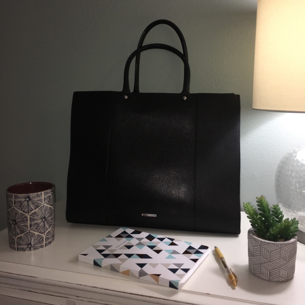 Black leather tote with protective feet